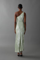 Green Aisl one-shoulder maxi dress styled on a model, showcasing elegant drape and flowing fabric.