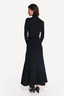 Black coal long sleeve top from DELEGAN, styled back view showcasing fitted design and soft fabric.