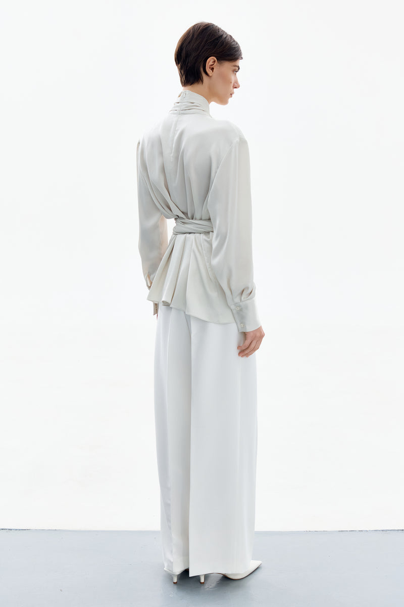 Pearl white wrapped blouse by DELEGAN, stylish shirt with elegant design, shown from the back in this image.