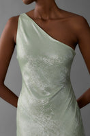 Green one-shoulder maxi dress by Aisl, styled with flowing fabric and elegant design perfect for formal or summer occasions.