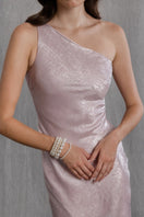 Aisl blush one-shoulder maxi dress with flowing fabric and elegant drape, styled for a sophisticated look.