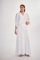 White DELEGAN blouse with tight sleeves, stylish front view showcasing a modern, fitted shirt design.