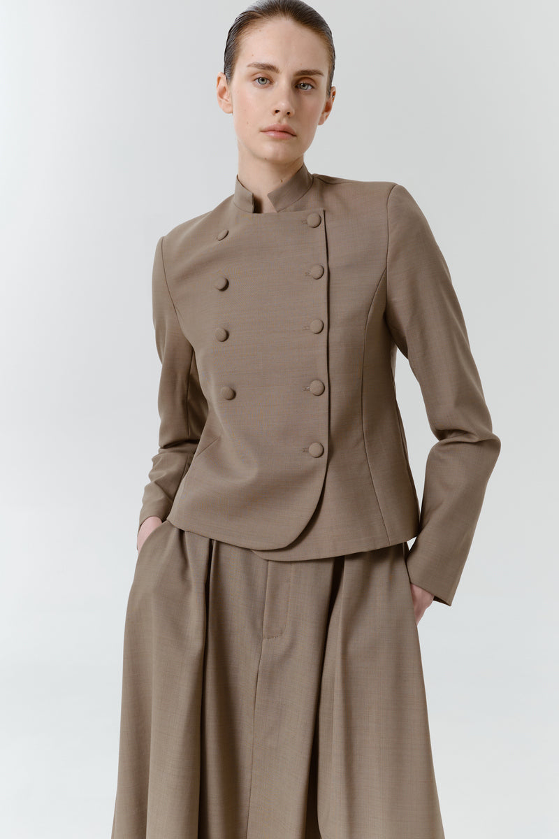 DELEGAN wool midi skirt styled on a model, featuring a high waist and flowing midi length for a chic, elegant look.