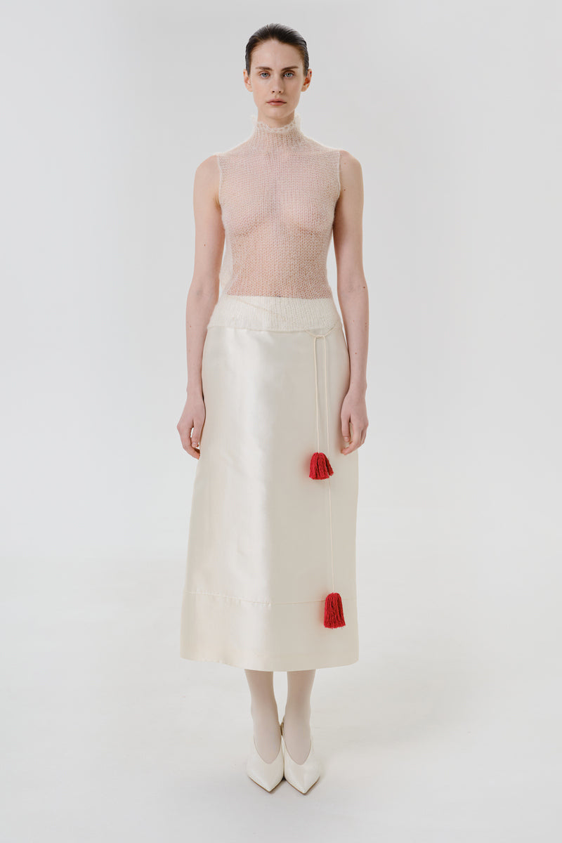Front view of DELEGAN soft skin sheer knit top, showcasing its lightweight, fitted design in a stylish tops collection.