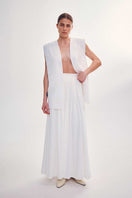 White milk-embroidered vest by DELEGAN, styled front view showing intricate embroidery and classic vest design.