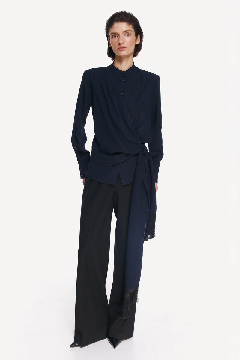 Front view of a stylish blue and black belted shirt by DELEGAN, featuring a modern design with a waist belt detail.