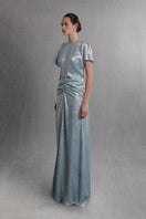 Light blue Aisl ruched center column gown with elegant draping and fitted waist, styled with a side view.