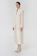 Delegan Still Form blazer jacket shown from side view, tailored fit with structured collar and sleek design.