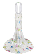 Multicolor backless sequin maxi gown with train by Sudi Etuz, elegant evening dress with shimmering embellishments and flowing train.