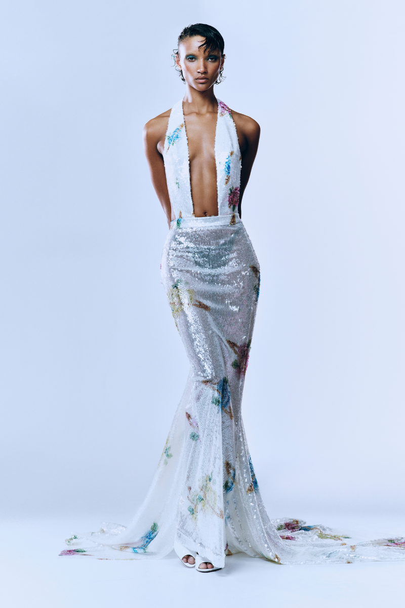 Backless sequined maxi gown with train by Sudi Etuz, featuring multicolor sequins and elegant floor-length design.