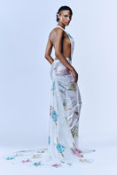 Sudi Etuz backless sequin maxi gown with train, multicolor, elegant evening dress, close-up of shimmering fabric and flowing train.