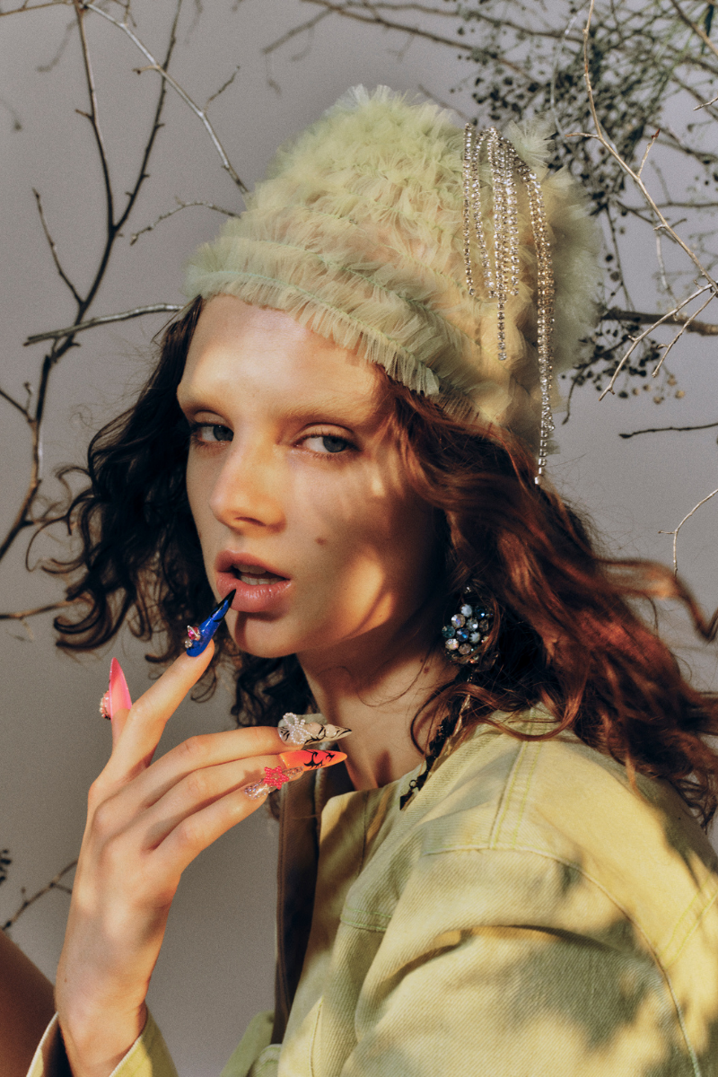 Green denim mini cropped blazer by Sudi Etuz, featuring a fitted design and classic collar detail.