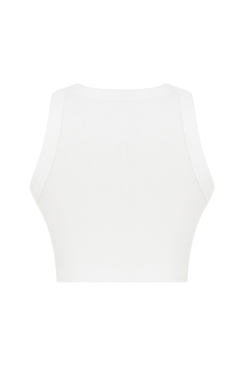 Pink Sudi Etuz cut-out top with handmade flower accessory, stylish sleeveless blouse perfect for casual or summer wear.