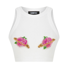Pink Sudi Etuz cut-out top with handmade flower accessory, featuring stylish design and vibrant color for trendy fashion.