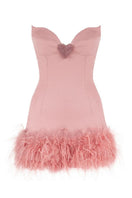 Sudi Etuz Rosy Feather strapless mini dress in rose color, featuring a fitted silhouette and feather details, shown on a mannequin.