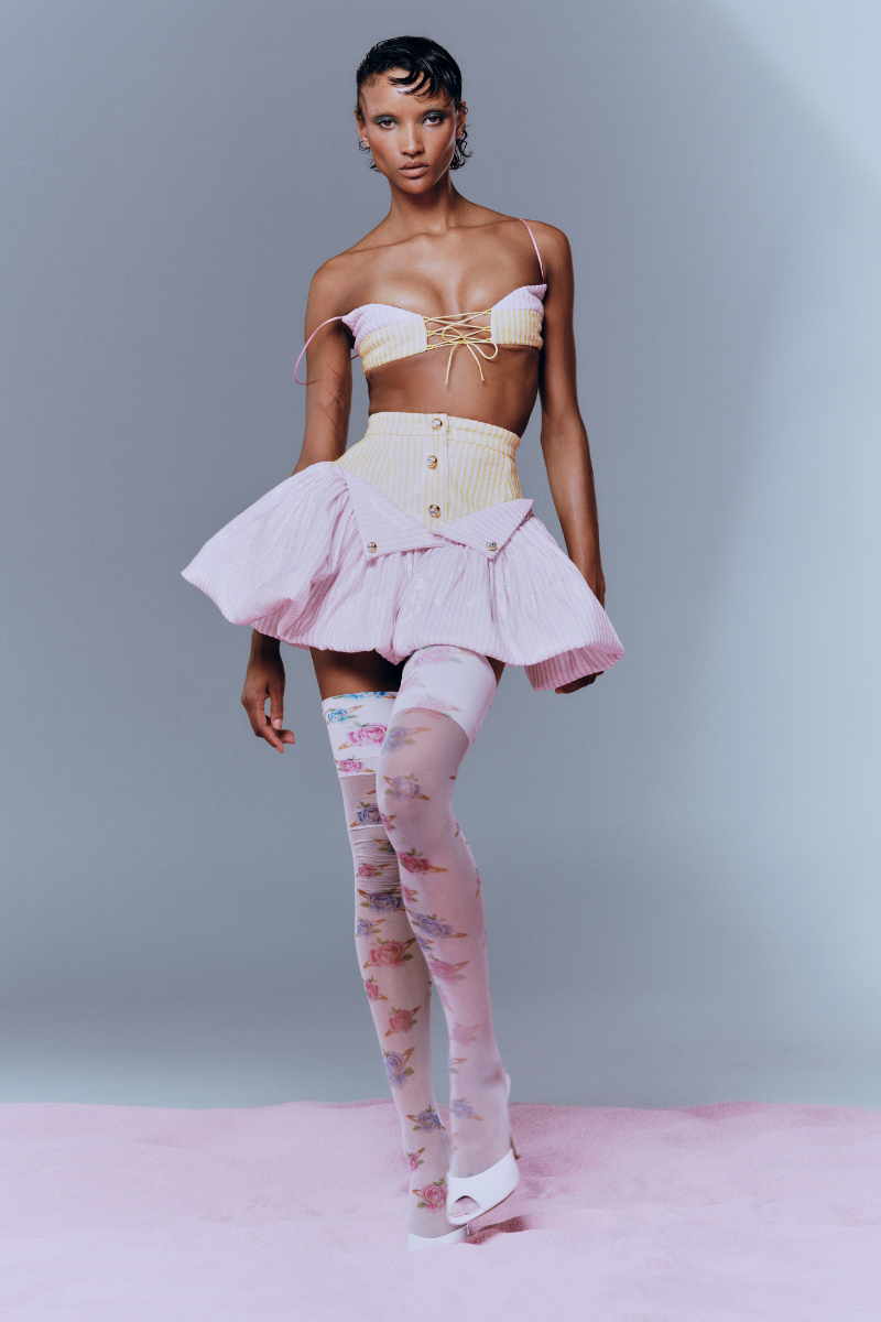 Pink and yellow sequin ruffle mini skirt by Sudi Etuz, featuring vibrant colors and a stylish ruffled design.