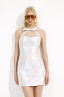 Urban Muse Sundelle mini dress in white, featuring a stylish sleeveless design and lightweight fabric, perfect for summer wear.