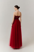 Red floral tweed and organza gown by Happy Clothing, featuring a flowing silhouette and intricate floral detailing.