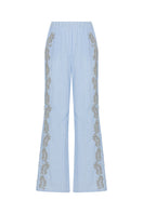 Blue embroidered pants with elastic waistband from TAGG, featuring intricate embroidery and comfortable fit.