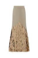Hand embroidered gold whale design maxi skirt by TAGG featuring intricate embroidery and flowing fabric.