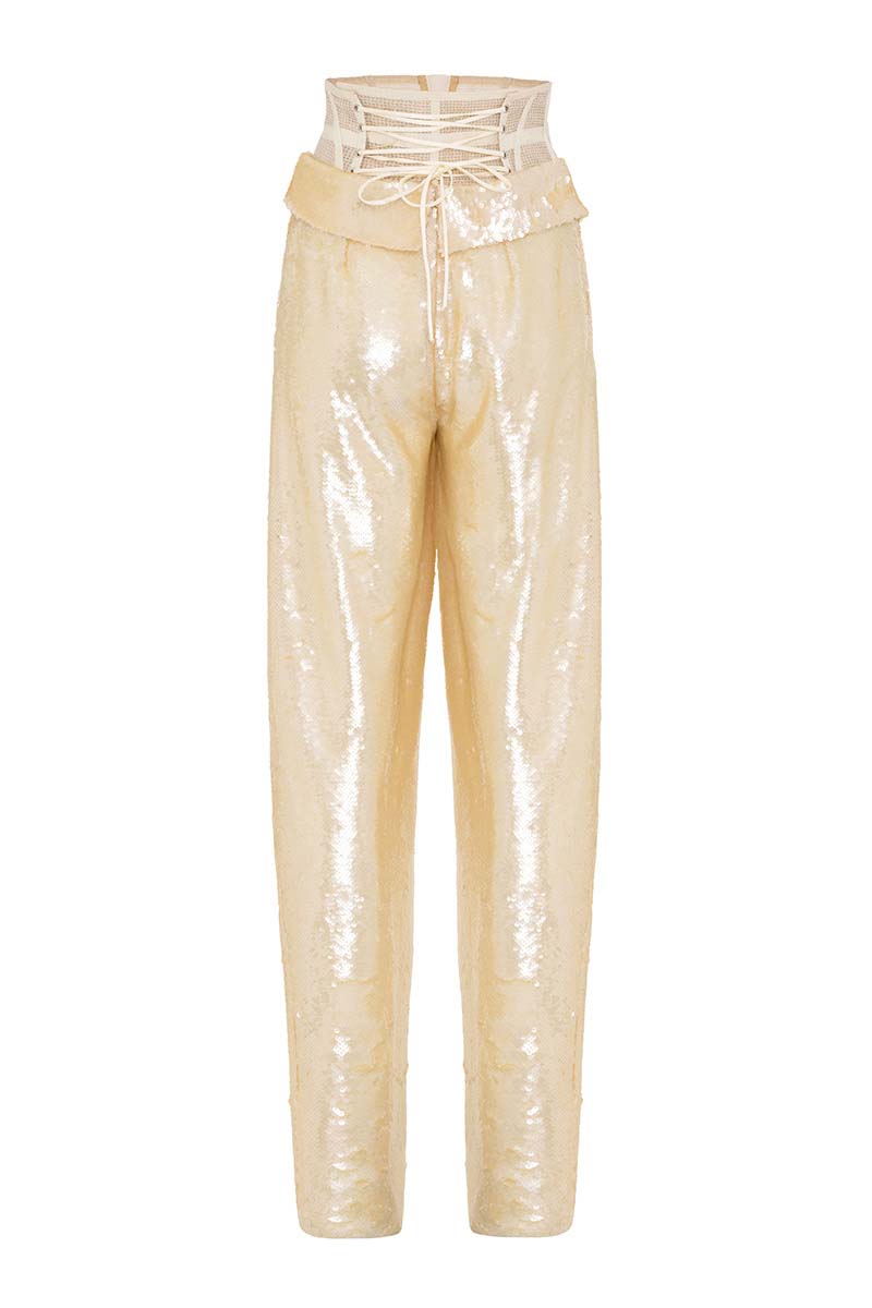Tayfun Kaba cream corset pants featuring a fitted waist and tailored design, showcased on a model in a stylish urban setting.