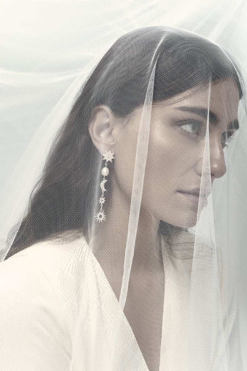 Silver earrings from LAVANI JEWELS titled The Justice featuring intricate design and polished finish.