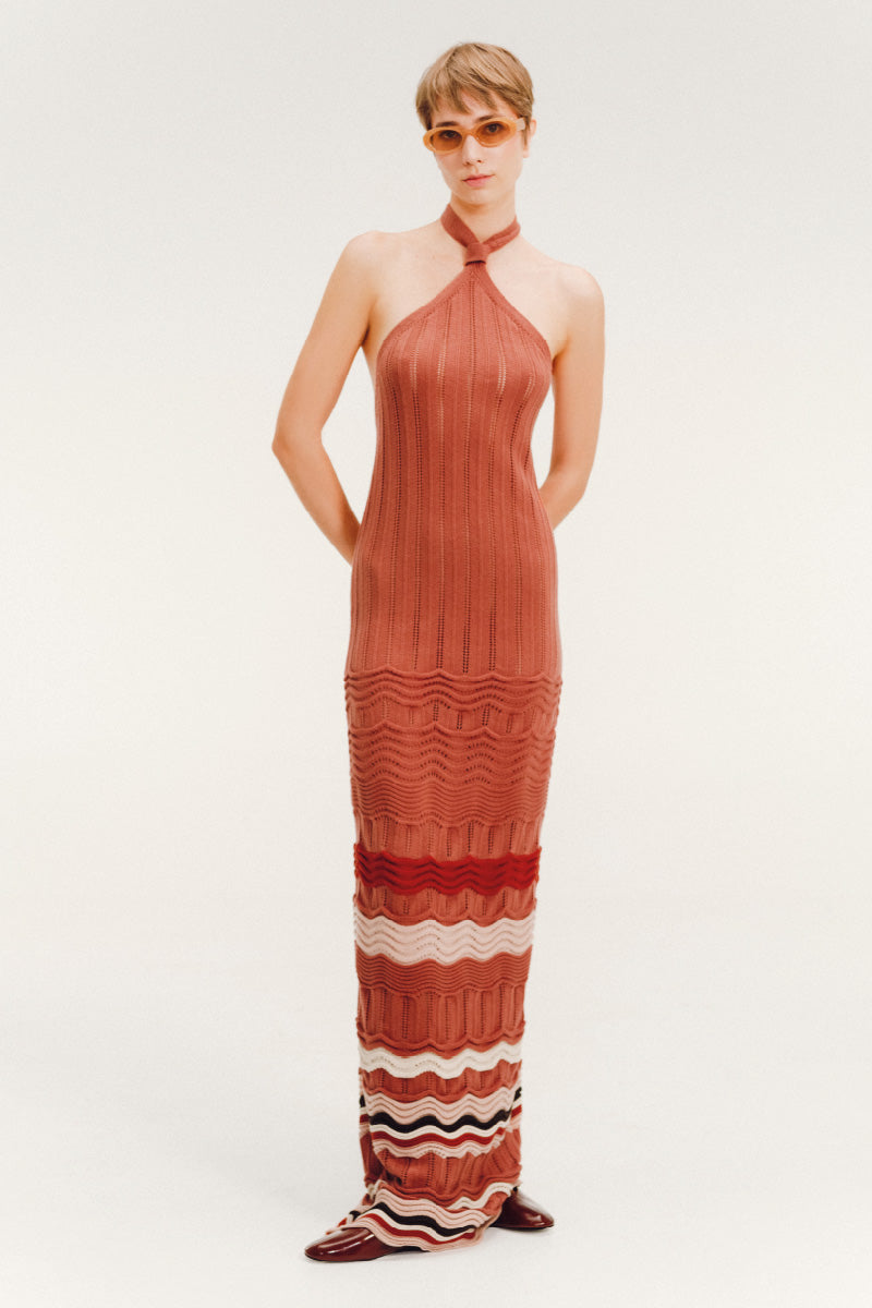 Vorn Design Takana Blossom maxi dress featuring floral pattern and flowing fabric, displayed on a hanger.