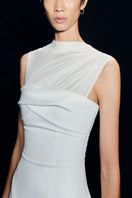 White pleating shoulder maxi dress by TONYY, featuring flowing fabric and elegant design, perfect for formal or casual occasions.