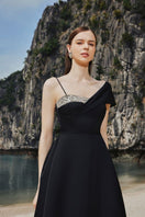 Black asymmetrical crystal-embroidered one-shoulder midi dress by Tracy Studio, showcasing elegant embroidery and a sleek silhouette.