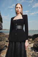 Black long sleeve blazer and skirt co-ord set by Tracy Studio featuring a trapezoid neckline, tailored fit, and sleek style.