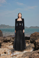 Black long-sleeve blazer and skirt set by Tracy Studio featuring a trapezoid neckline, stylish co-ord ensemble.