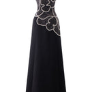 Black sleeveless orchid patterned gown by Tracy Studio, showcasing elegant floral design and flowing fabric.