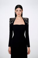 Black Tracy Studio long sleeve trapezoid neckline bodycon gown, full-length dress with fitted silhouette and elegant design.