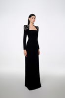 Black Tracy Studio long sleeve trapezoid neckline bodycon gown, fitted full-length dress for elegant occasions.