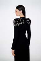Black Tracy Studio long sleeve bodycon gown with trapezoid neckline, fitted full-length dress, size XXS.