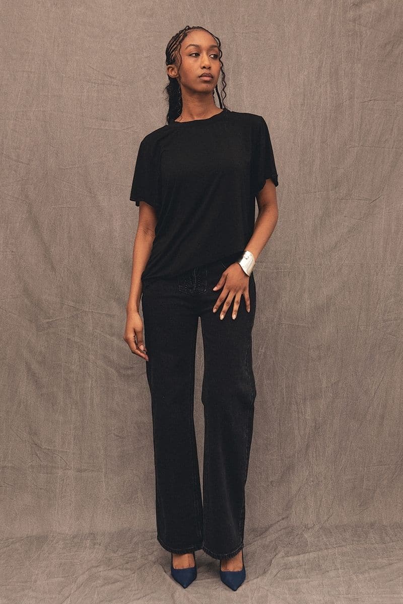 Black Mikey straight leg jeans by TT Studios, shown on a model, featuring a classic fit and denim texture.