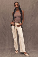 Cream contrast Mikey straight leg jeans by TT Studios, shown in a casual fit on a model.
