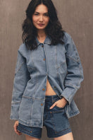 Relaxed fit denim jacket by TT Studios, Linda Union SQ style, shown in light blue denim with classic collar and button front.