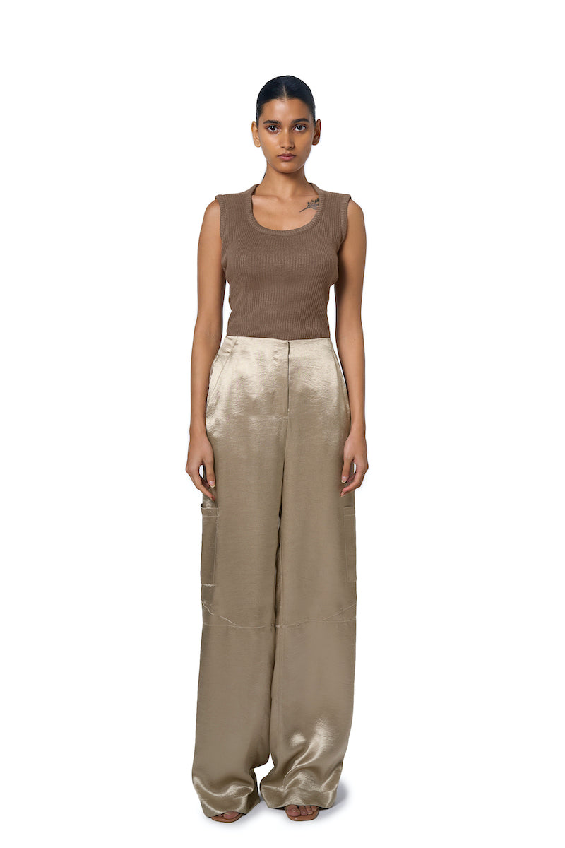 Light beige URA Marie trousers in champagne fabric, featuring a tailored fit and stylish design.