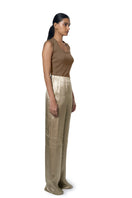 URa Marie trousers in champagne color, stylish pants with tailored fit, shown on a model with a neutral background.
