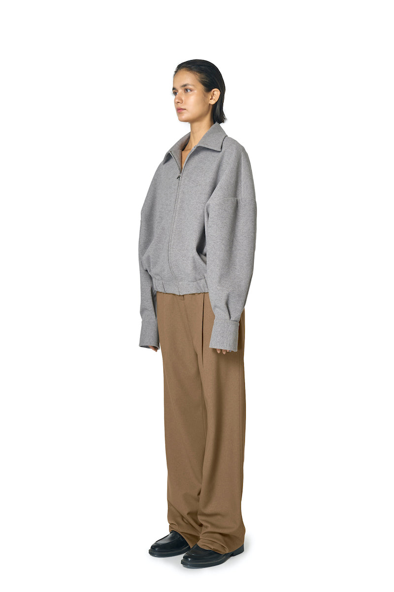 Gray Steph jacket by URA, stylish women's outerwear featuring a tailored fit and modern design, shown on a model.