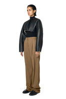 Black Adele bomber jacket by URA featuring a stylish, fitted design and ribbed cuffs on a mannequin.