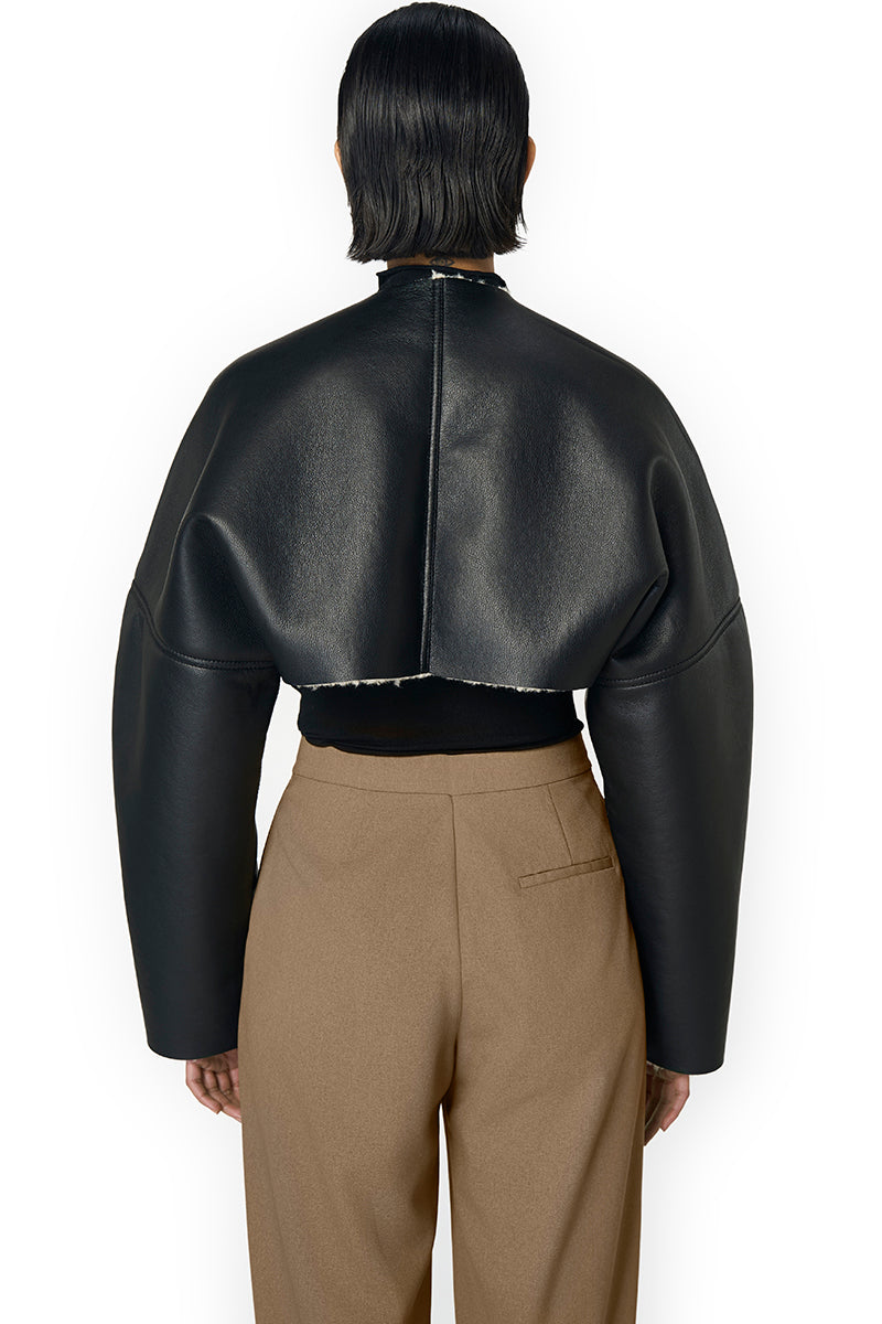 Black Adele bomber jacket by URA with a stylish fit, featuring a sleek design and ribbed cuffs, perfect for casual wear.