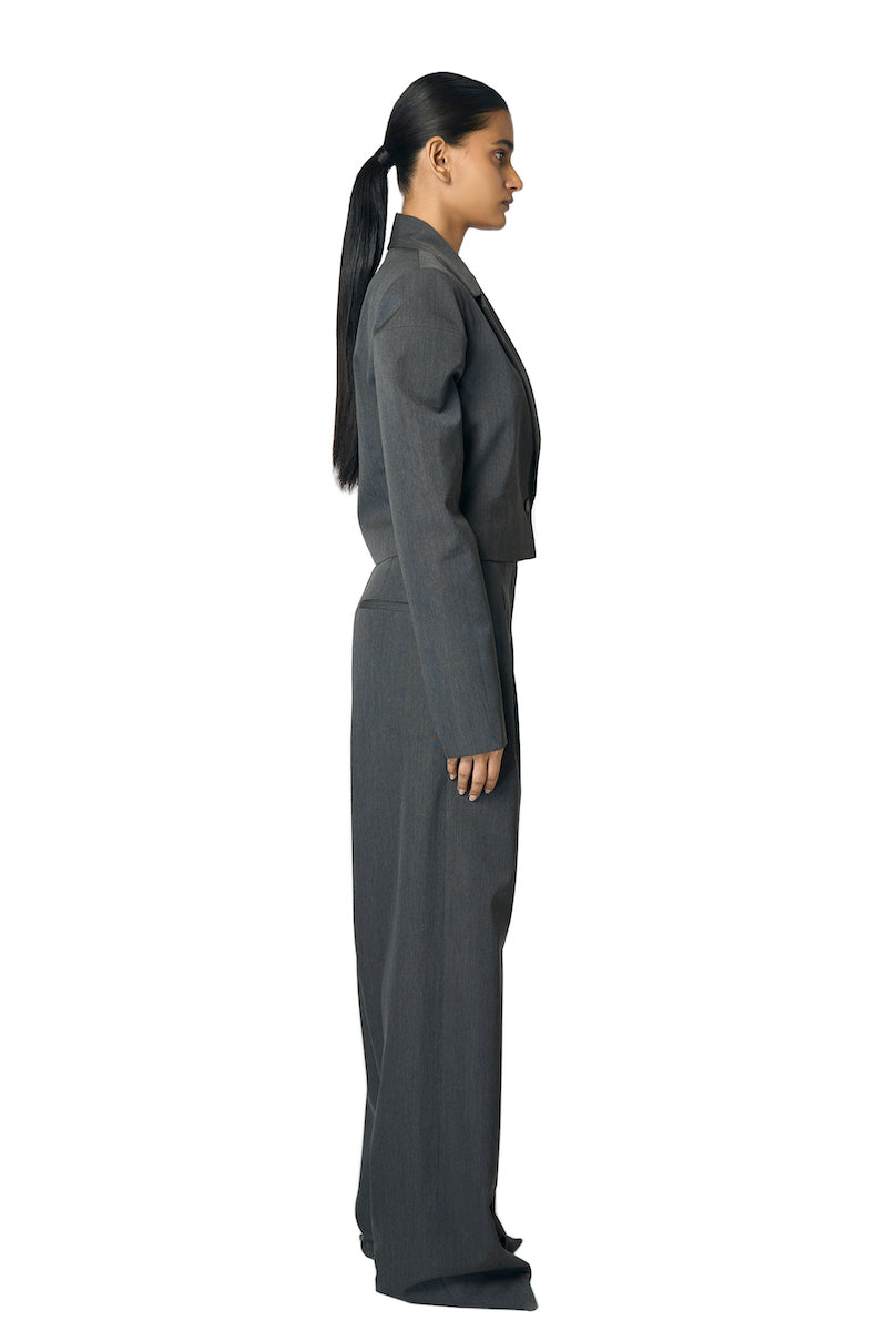 Gray Rudy jacket by URA featuring a sleek design, shown on a model with a modern urban style.