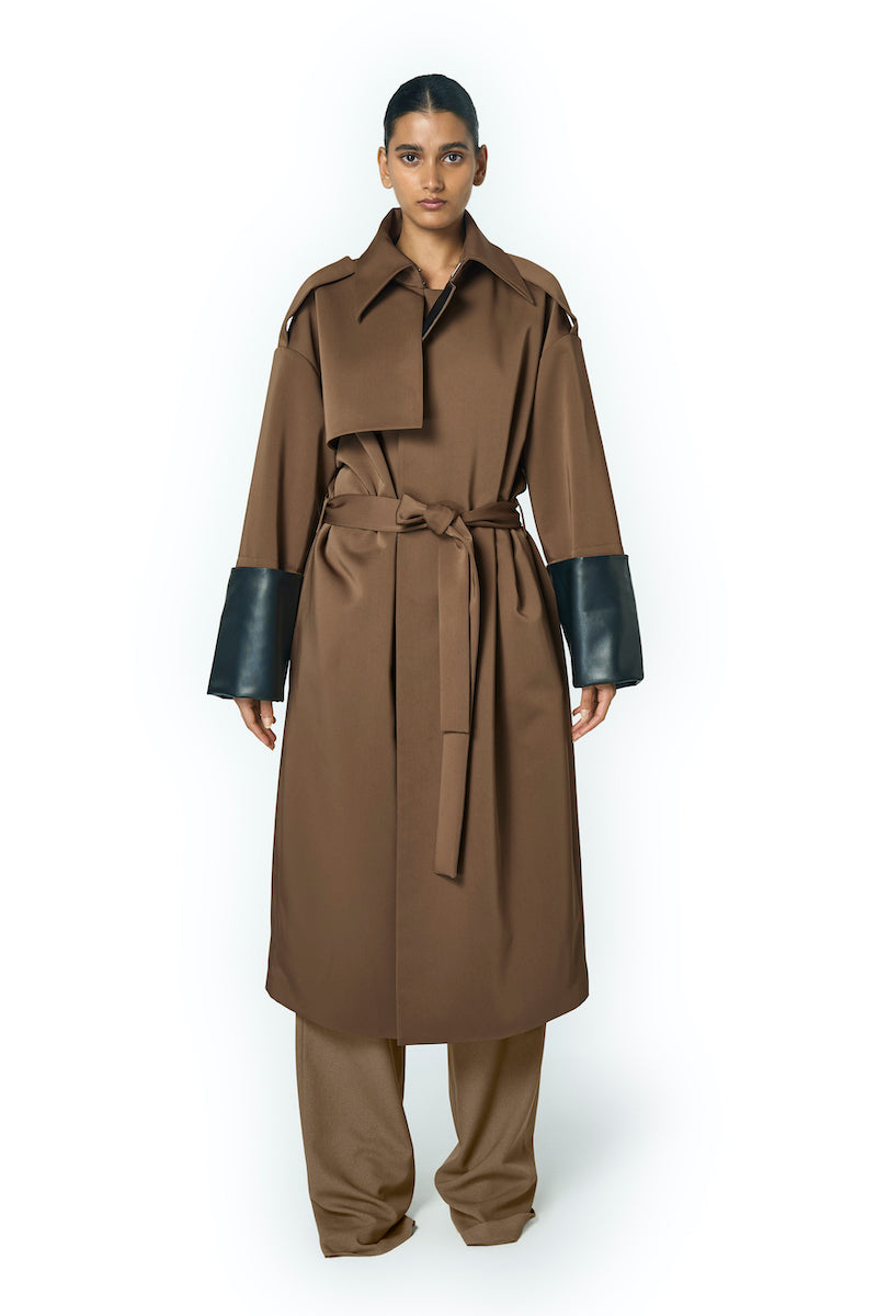 URA ADA camel coat displayed on a model, featuring a stylish, tailored design perfect for fall and winter wear.
