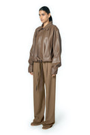 URA RIA jacket in toffee, stylish women's jacket with a smooth fabric finish, displayed on a neutral background.