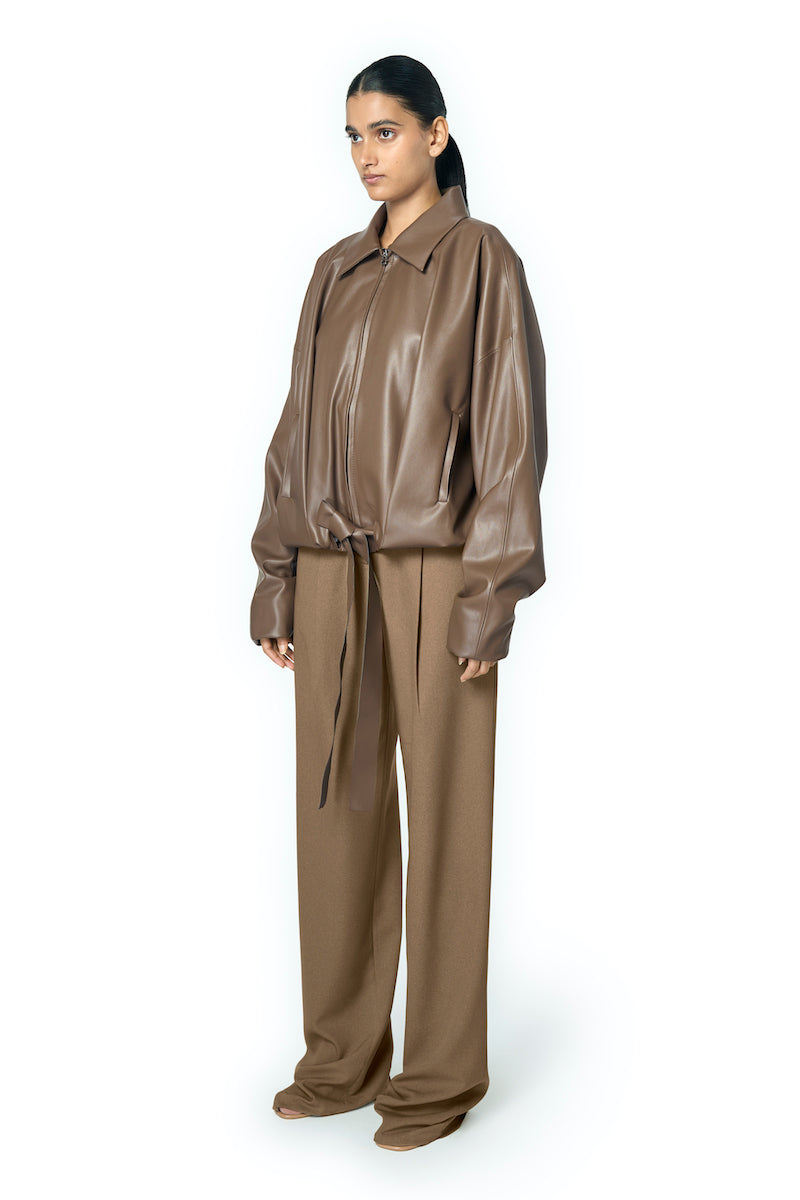 URA RIA jacket in toffee, stylish women's jacket with a smooth fabric finish, displayed on a neutral background.