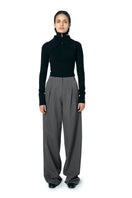 Black JOE B sweater by URA, close-up of the cozy knit fabric and classic fit, displayed on a neutral background.
