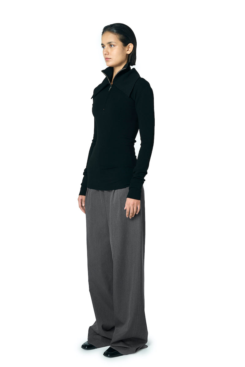 Black JOE B sweater by URA, featuring a comfortable knit design, displayed on a neutral background.