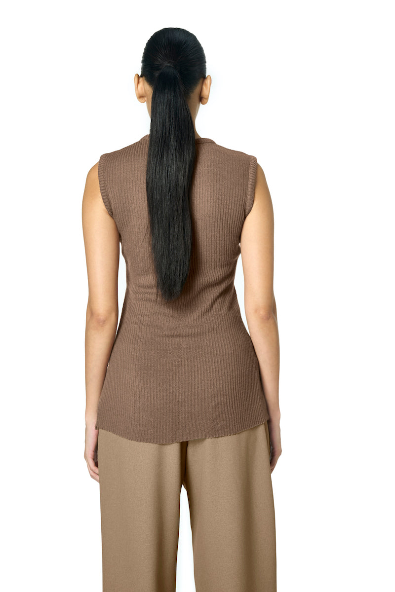 Brown URA ODA tank top displayed on a flat surface, showcasing its simple design and soft fabric.